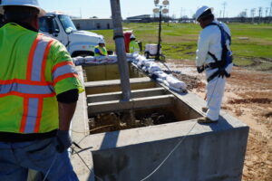 SAWS employees working to dislodge grease build up at Clouse Water Recycling Plant